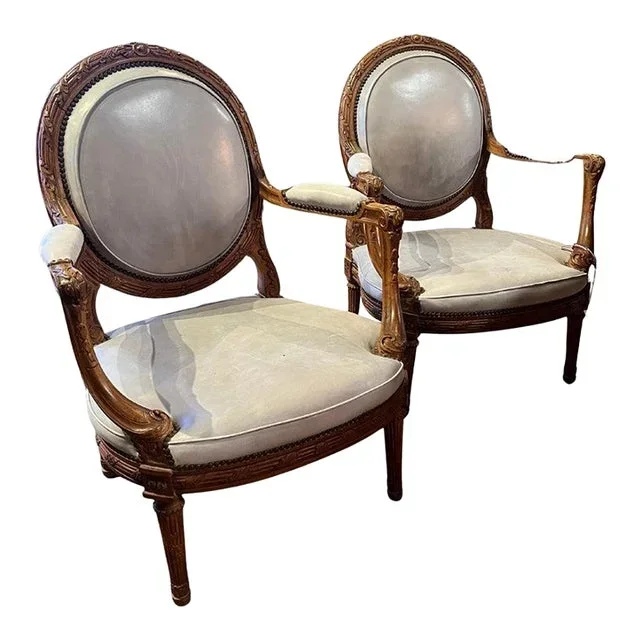 19th Century Late Pair Louis XVI Style Walnut Fauteuils