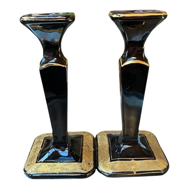 A Pair of Art Deco Jet Black Glass Tapered Candlesticks With Gold Decoration