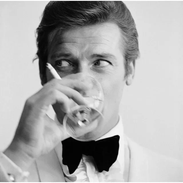 Shaken Not Stirred’ Roger Moore as James Bond Contemporary Archival Black and White Photograph Print From the Original Negative by Peter Ruck – 20×20